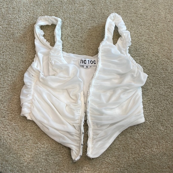 tic toc Tops - Tic Toc. White crop going out top.